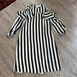Black & white stripe’s with shoulder cutouts and cute ruffle detail never worn